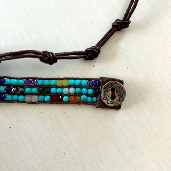Multicolored gemstone leather wrap bracelet.